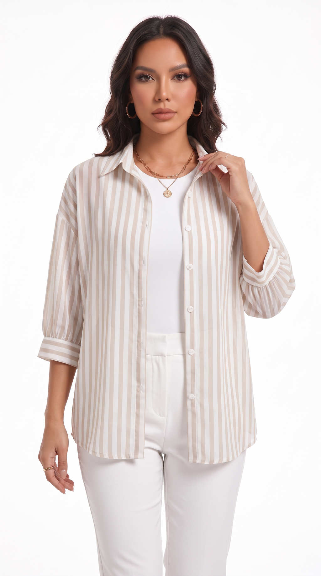 A woman modeling a cream and beige vertically striped button-up shirt over a white top and white pants, photographed against a plain white studio background, from Meleche Fashion USA or Meléche (short as (Mé))