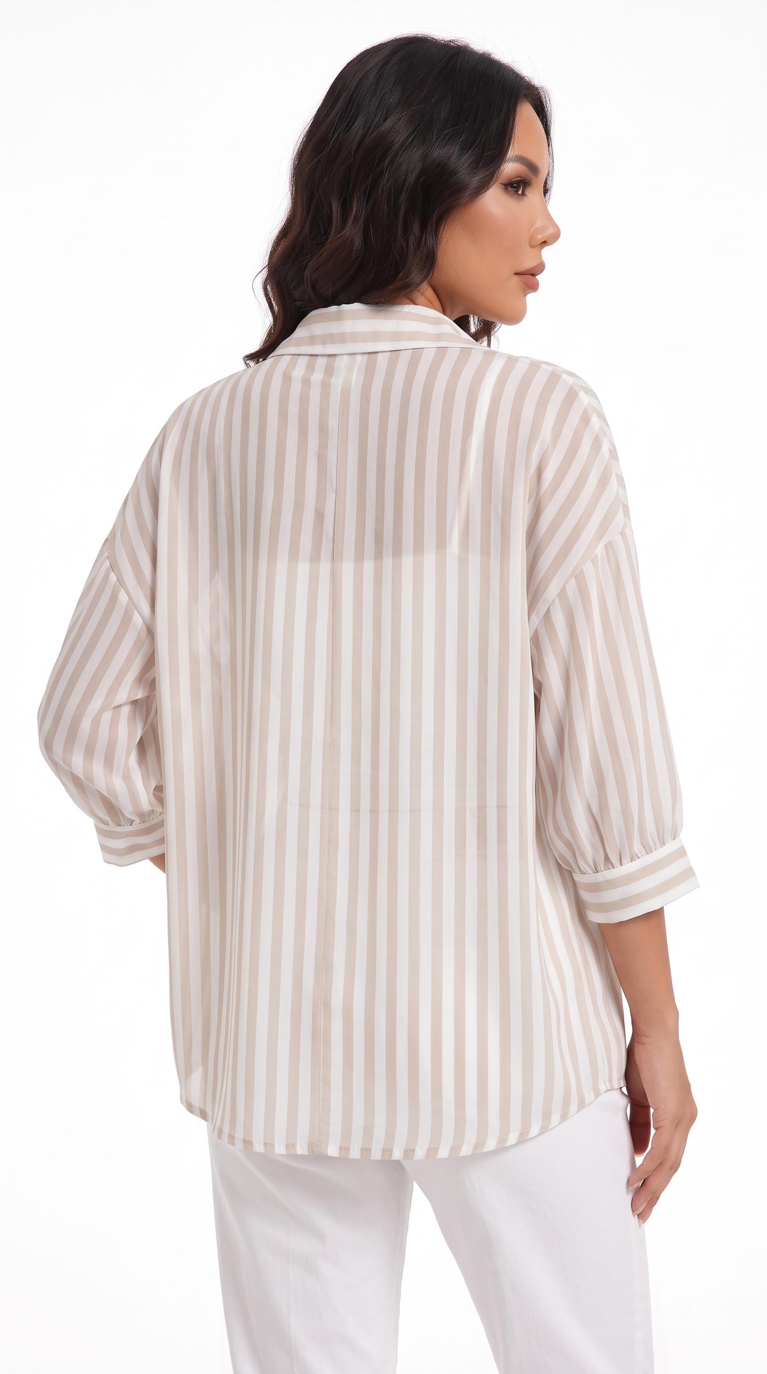 A woman shown from the back wearing a loose, oversized button-up blouse with vertical beige and white stripes, paired with white pants, against a plain white studio background, from Meleche Fashion USA or Meléche (short as (Mé))