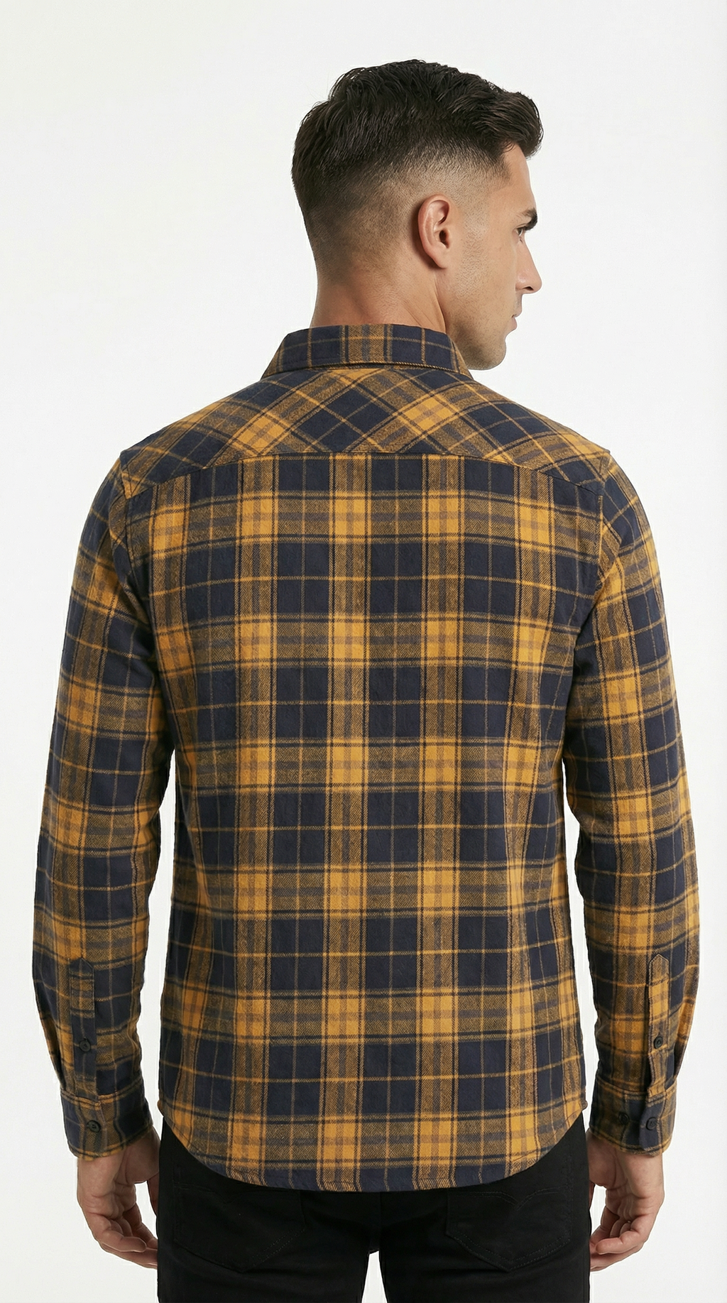 Man wearing a yellow and blue plaid shirt on a white background