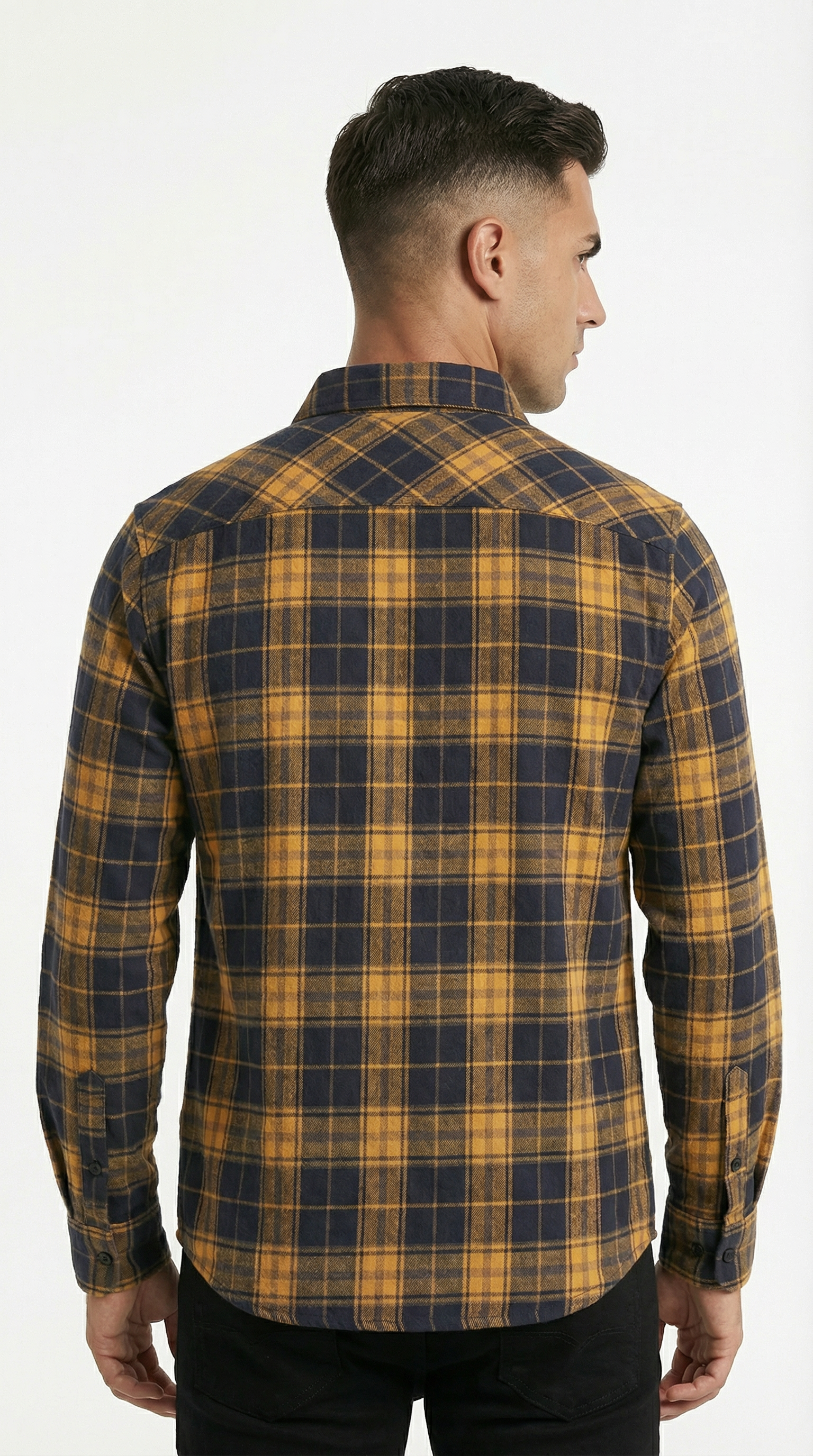 Man wearing a yellow and blue plaid shirt on a white background