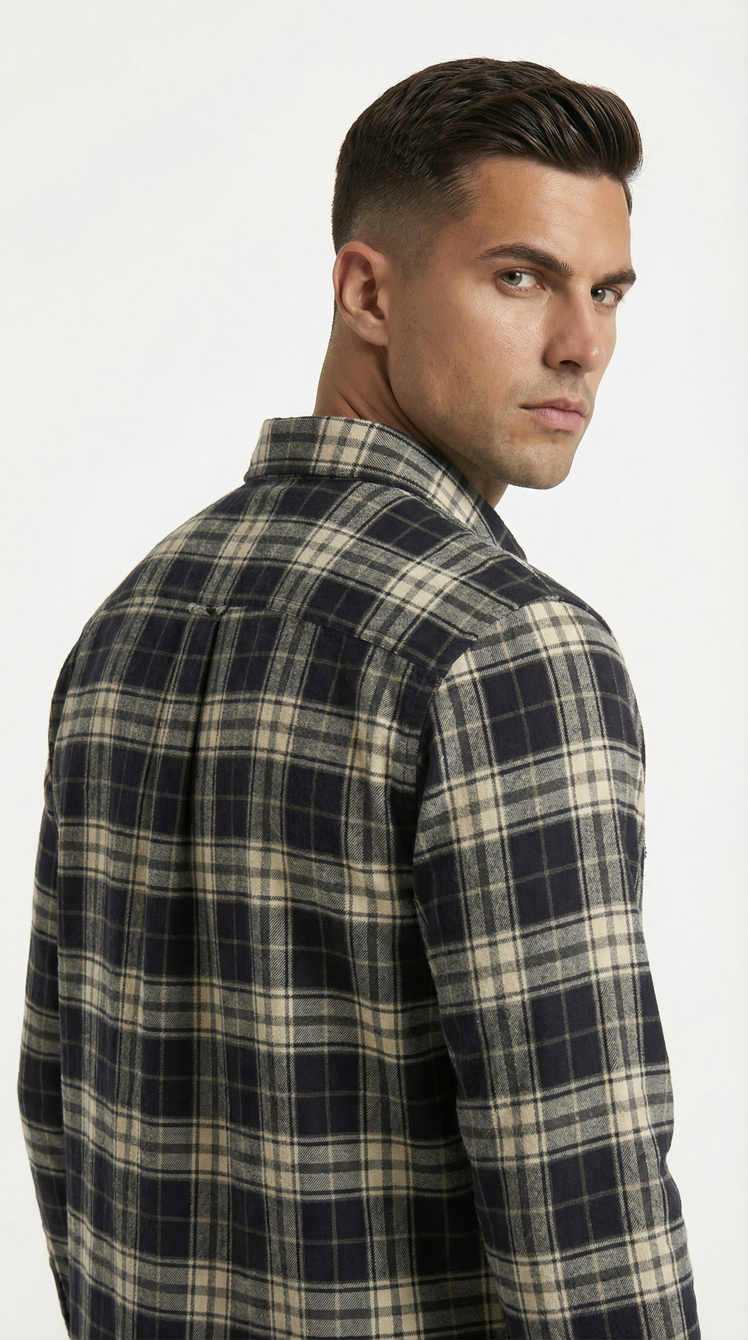Man wearing a plaid shirt on a white background