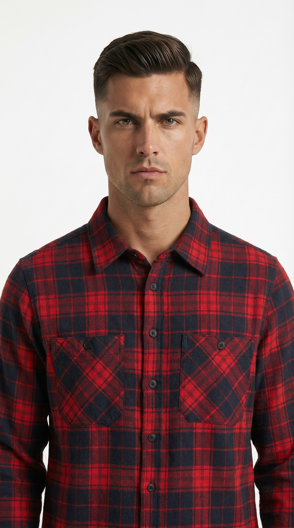 Man wearing a black patterned jacket over a black shirt on a white background