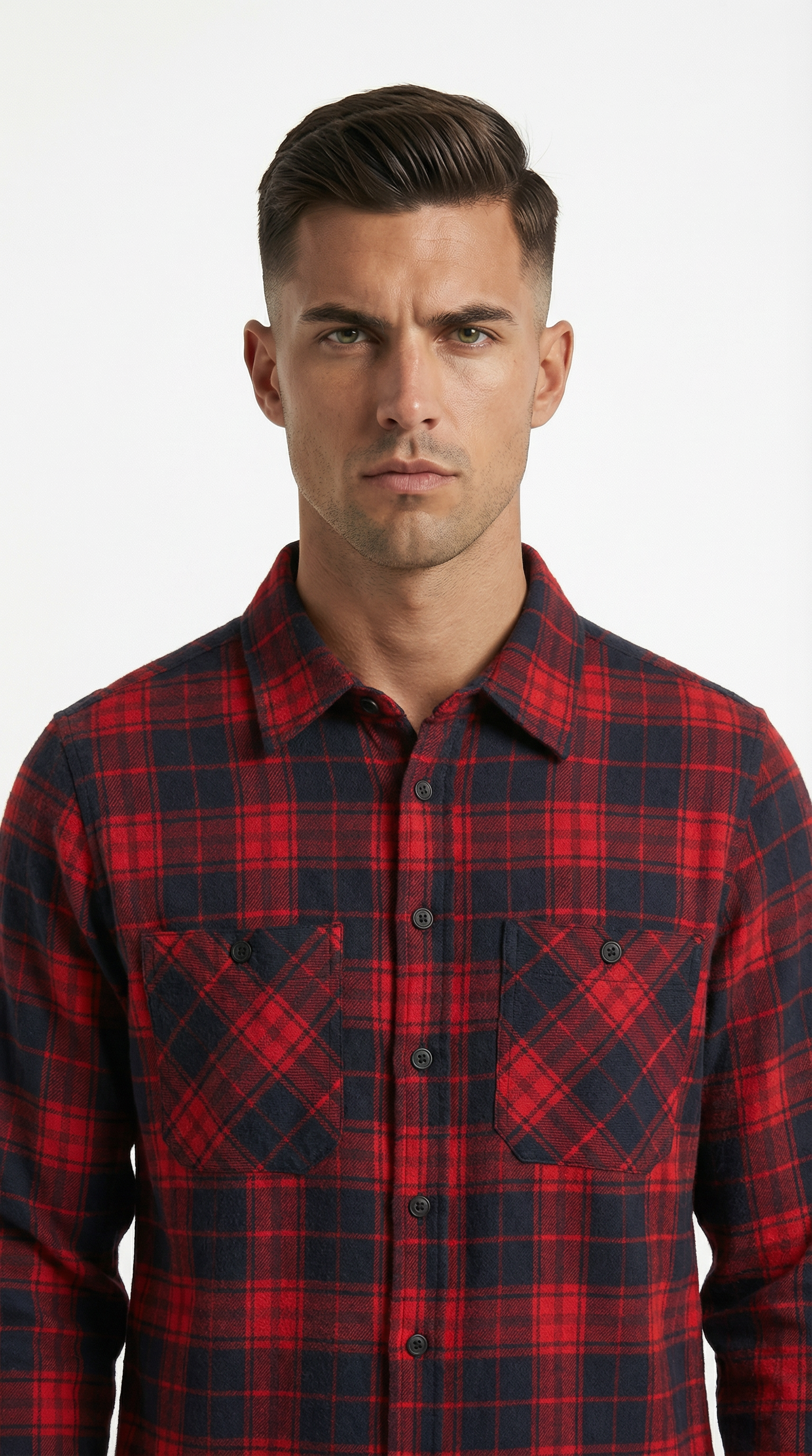 Man wearing a black patterned jacket over a black shirt on a white background