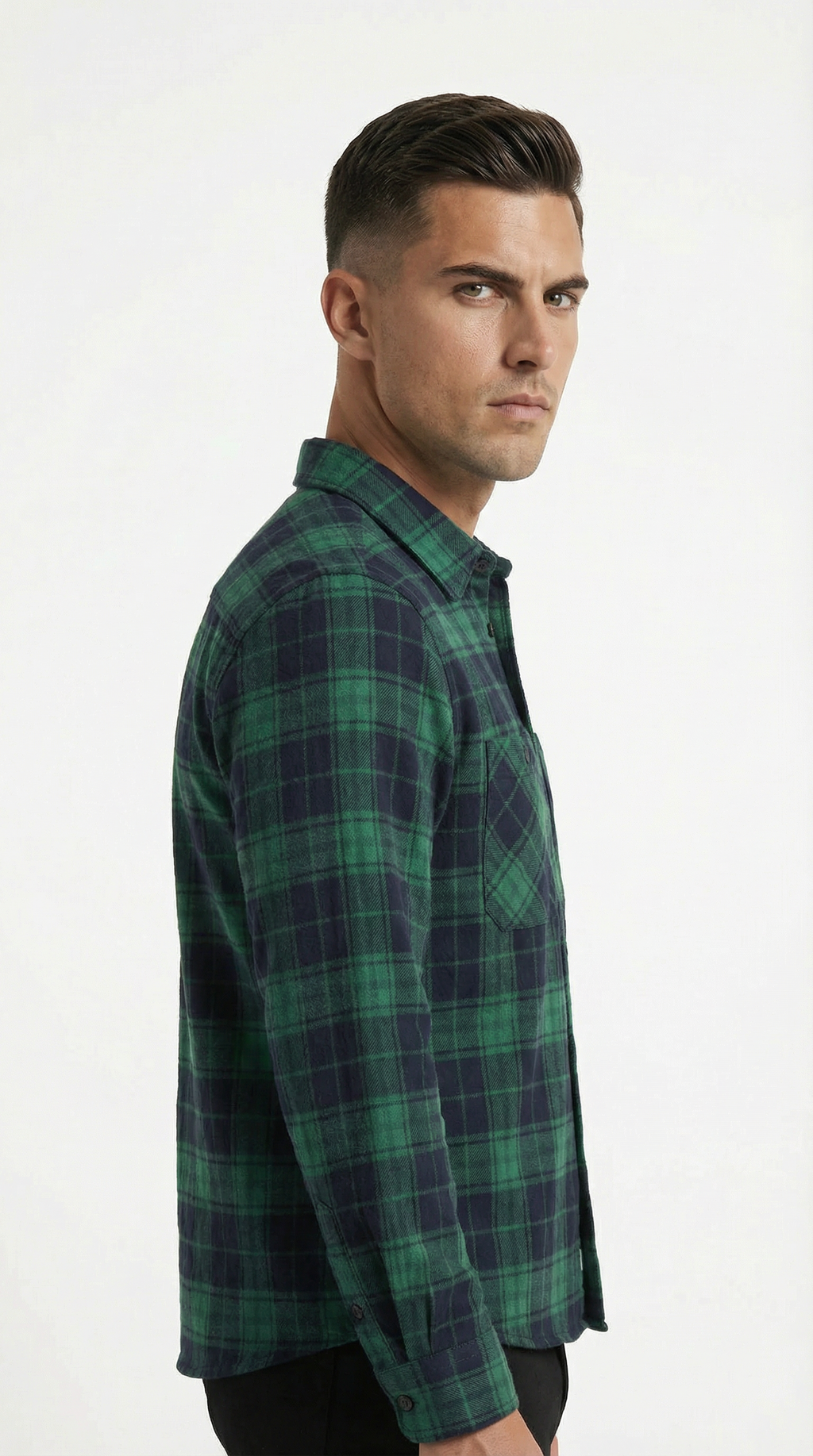 Man wearing a green plaid shirt on a white background