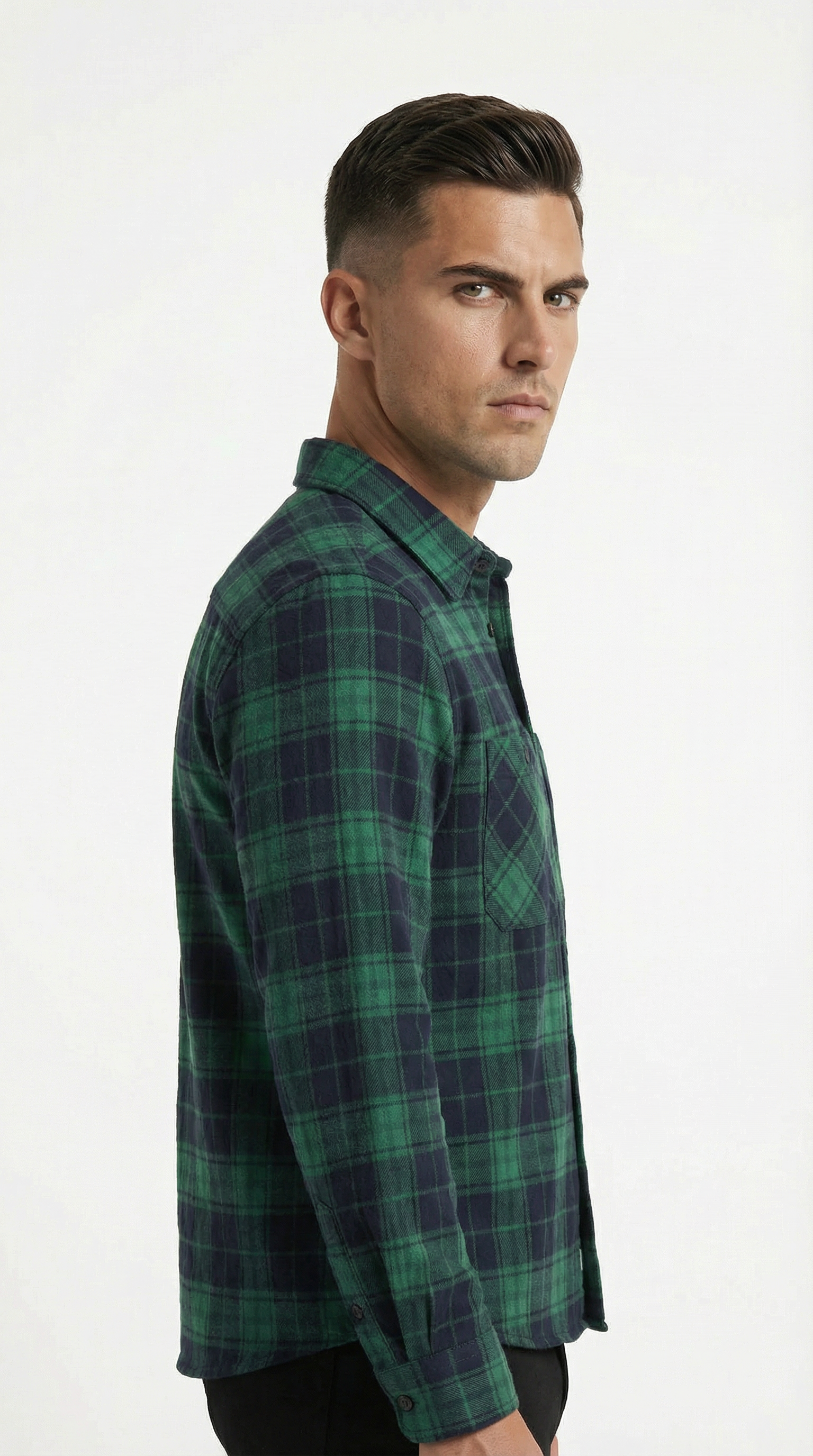 Man wearing a green plaid shirt on a white background