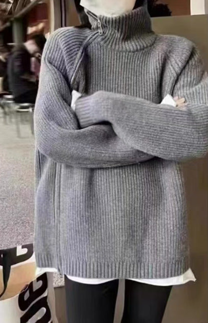 Person wearing a gray sweater from Meleche or Meléche (short as (Mé))