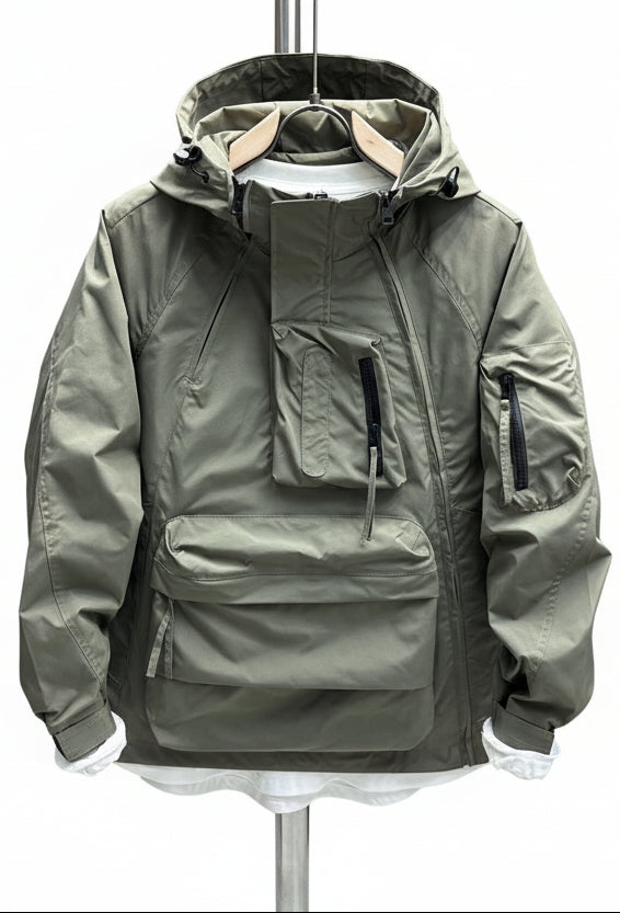 Green jacket on a mannequin against a textured wall.