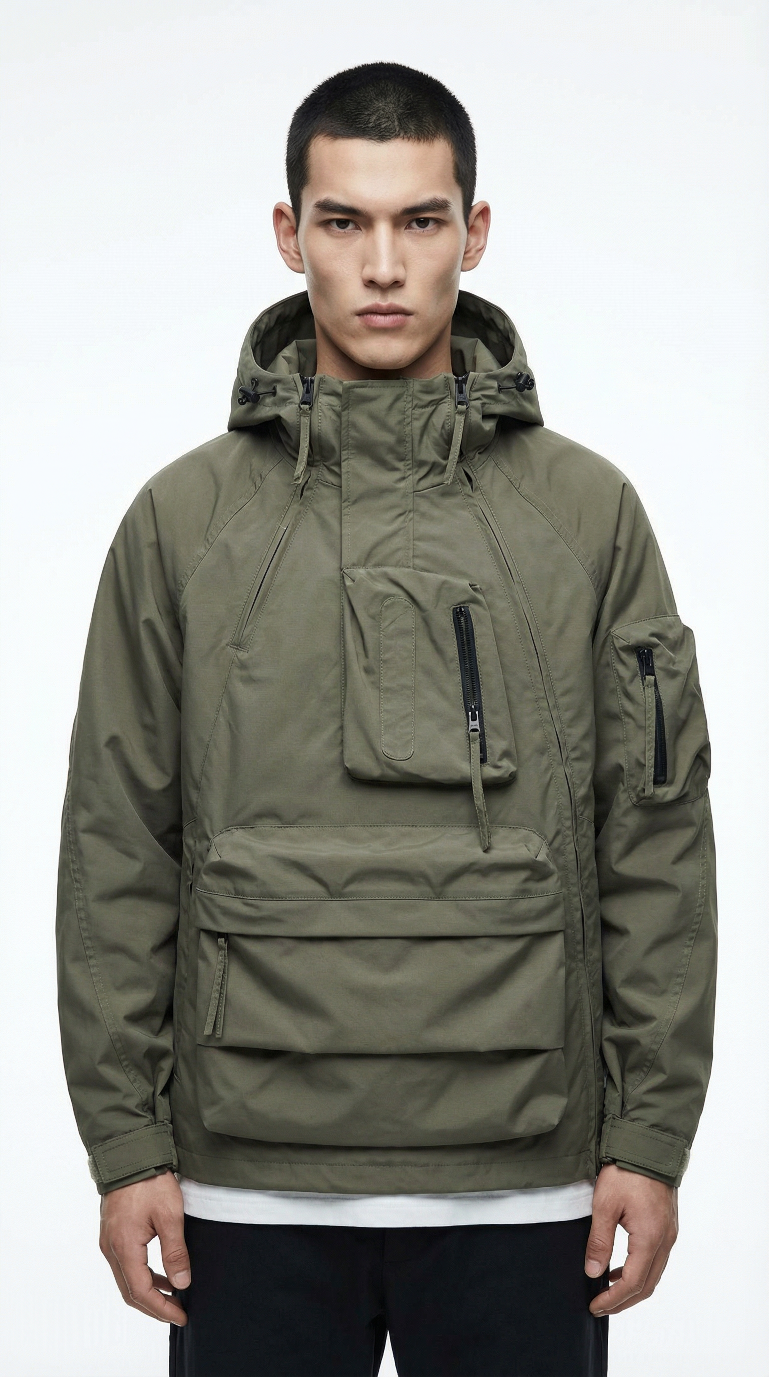 Person wearing a green jacket with multiple pockets on a white background