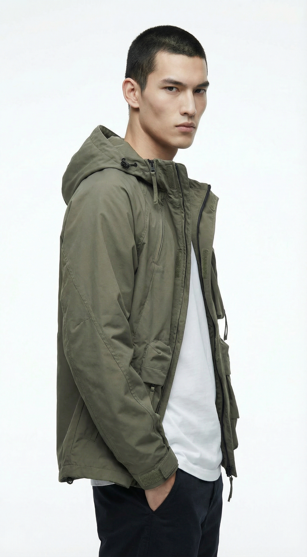 Man wearing a green jacket on a white background