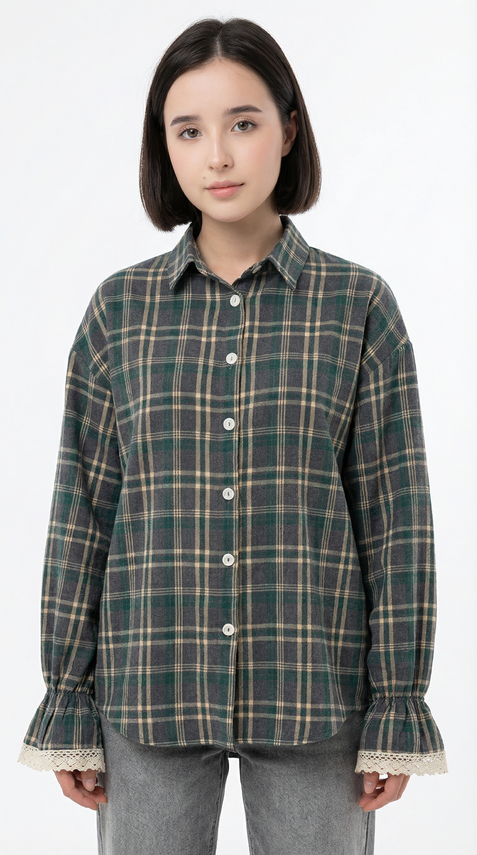 Woman wearing a pink blouse with ruffled details on a white background