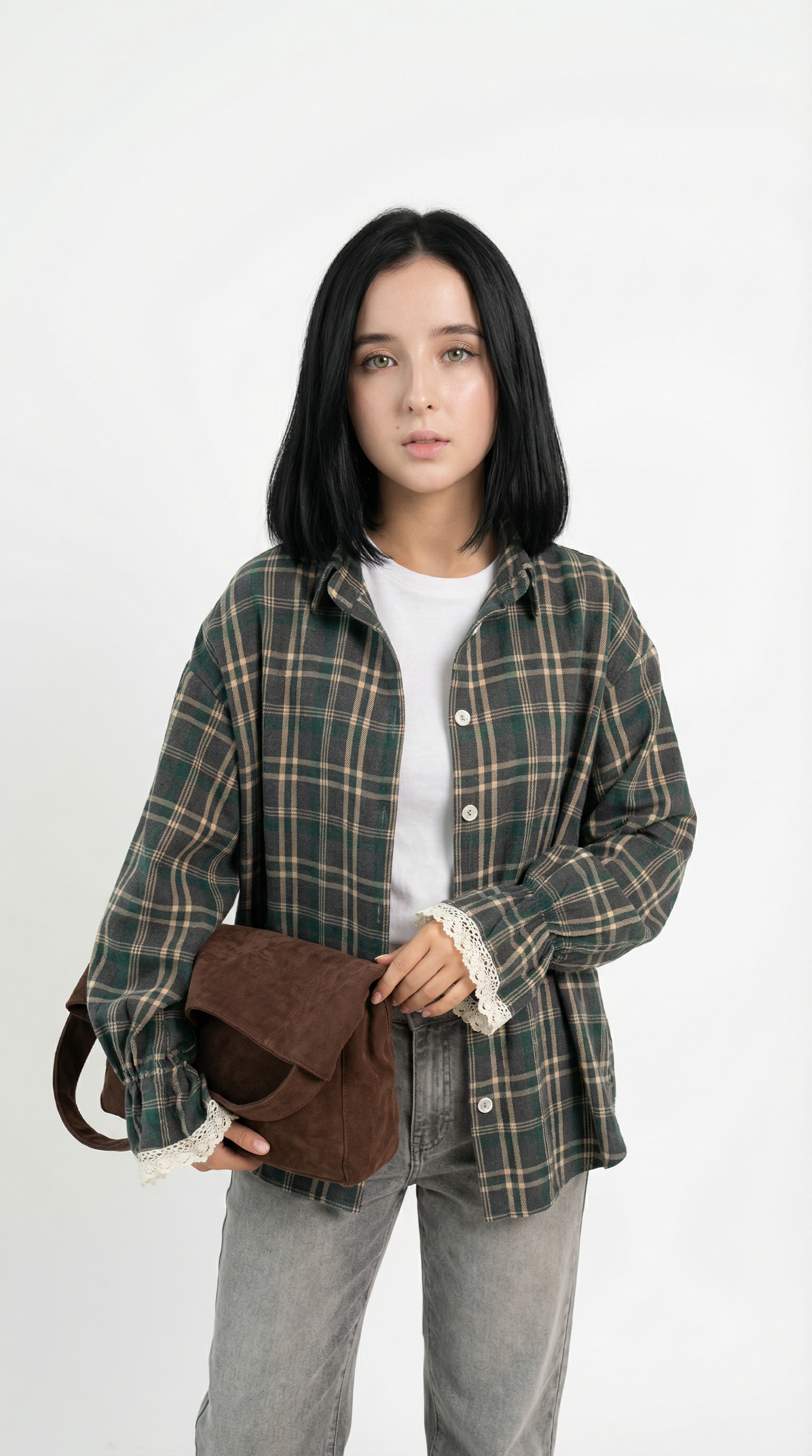 Woman wearing a plaid shirt holding a brown bag against a white background