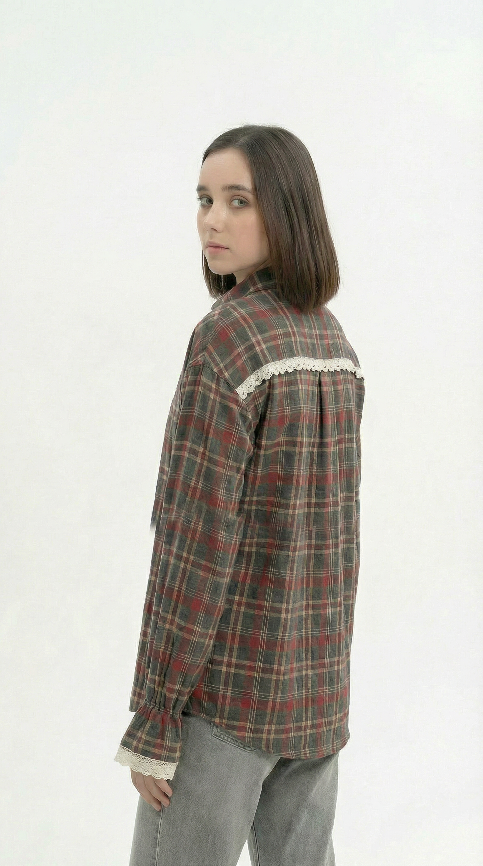 Person wearing a plaid shirt with lace details on a white background from Meleche Fashion USA or Meléche (short as (Mé))