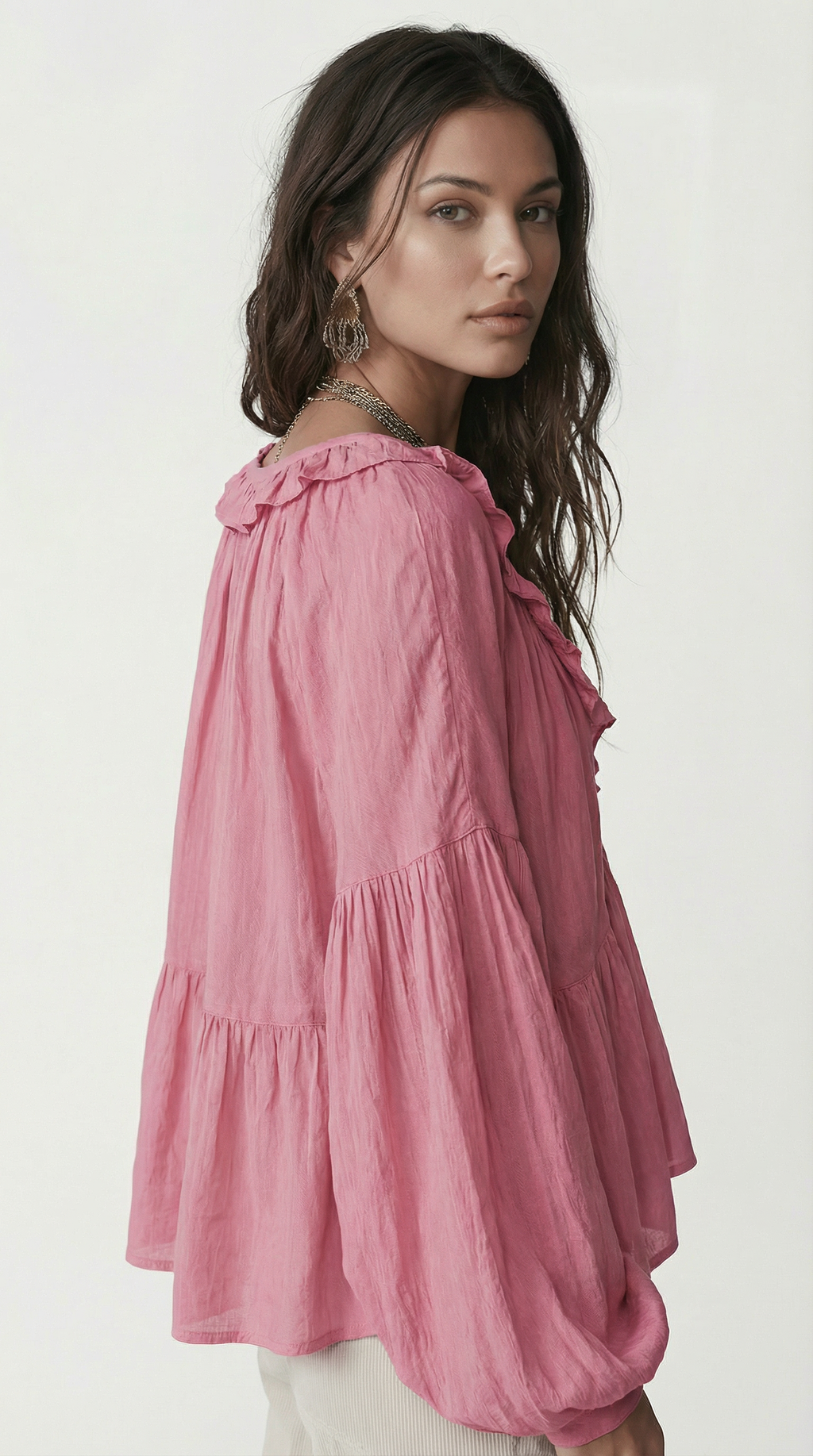 Woman wearing a pink tiered dress against a white background from Meleche Fashion USA or Meléche (short as (Mé))