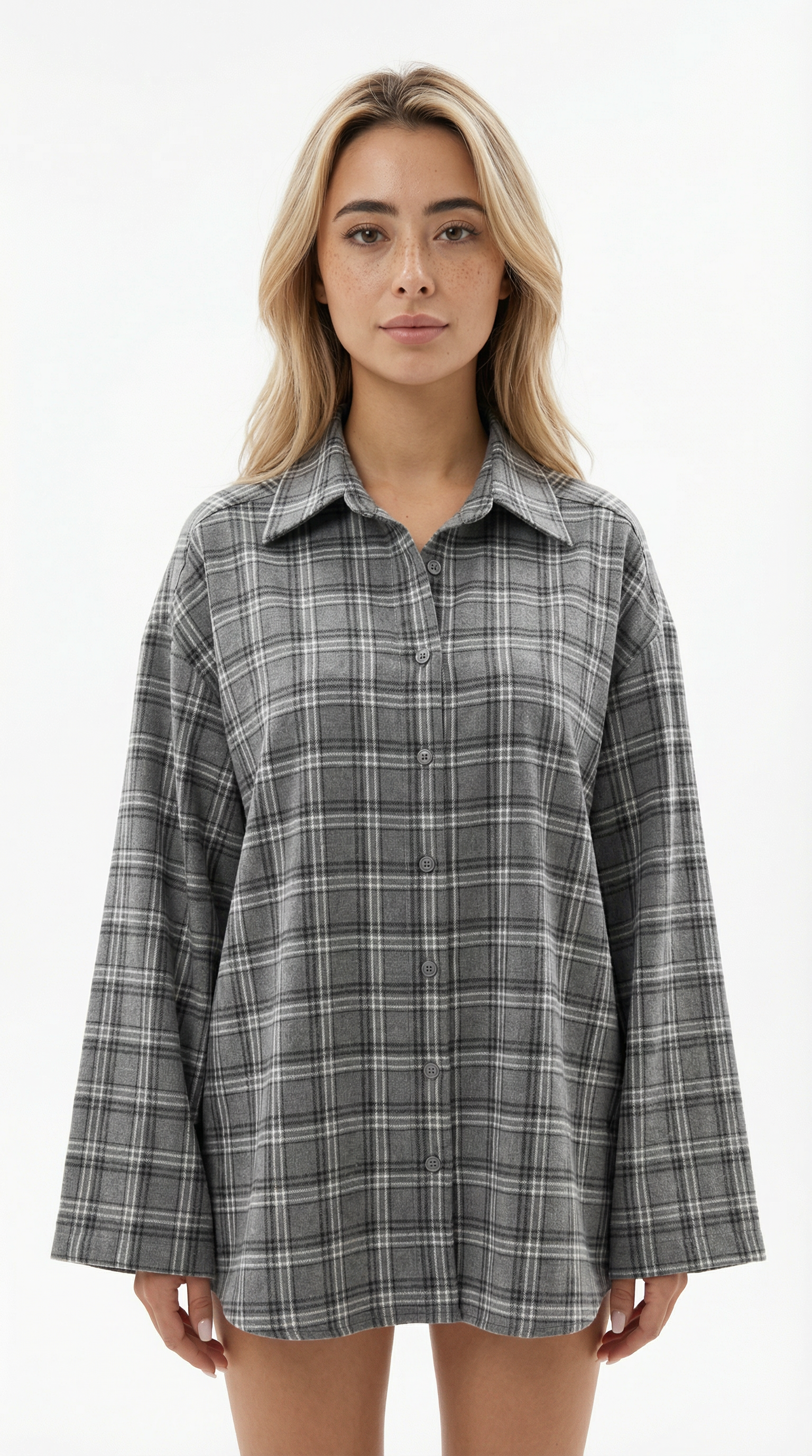 Woman wearing a gray plaid shirt on a white background