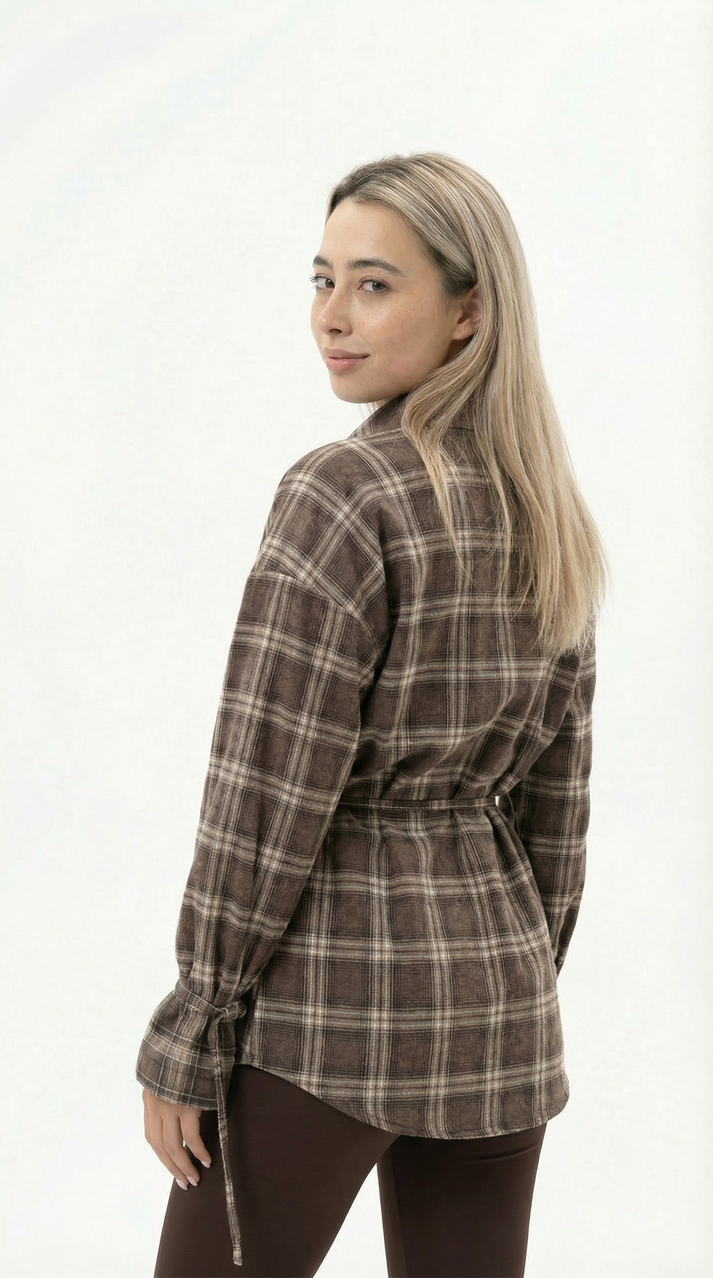 Woman wearing a brown plaid shirt on a white background from Meleche Fashion USA or Meléche (short as (Mé))