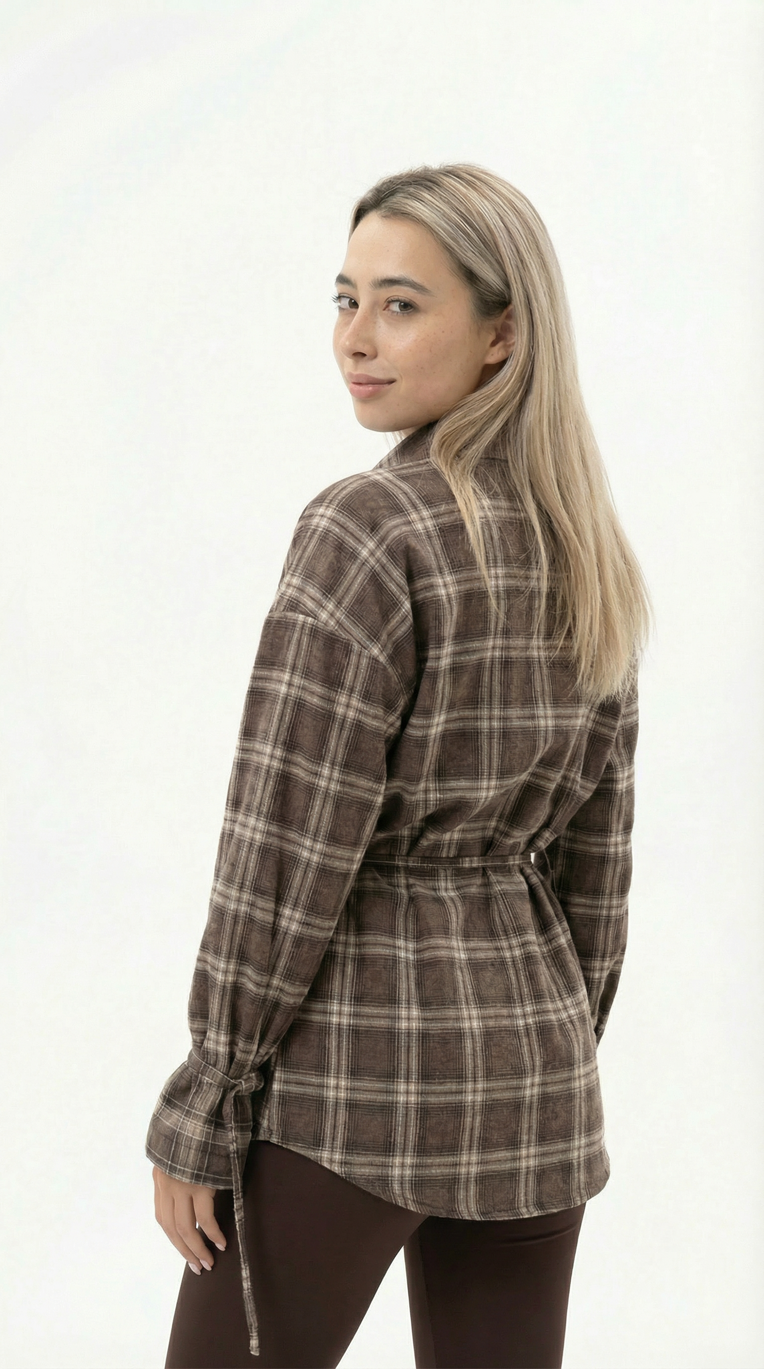 Woman wearing a brown plaid shirt on a white background from Meleche Fashion USA or Meléche (short as (Mé))