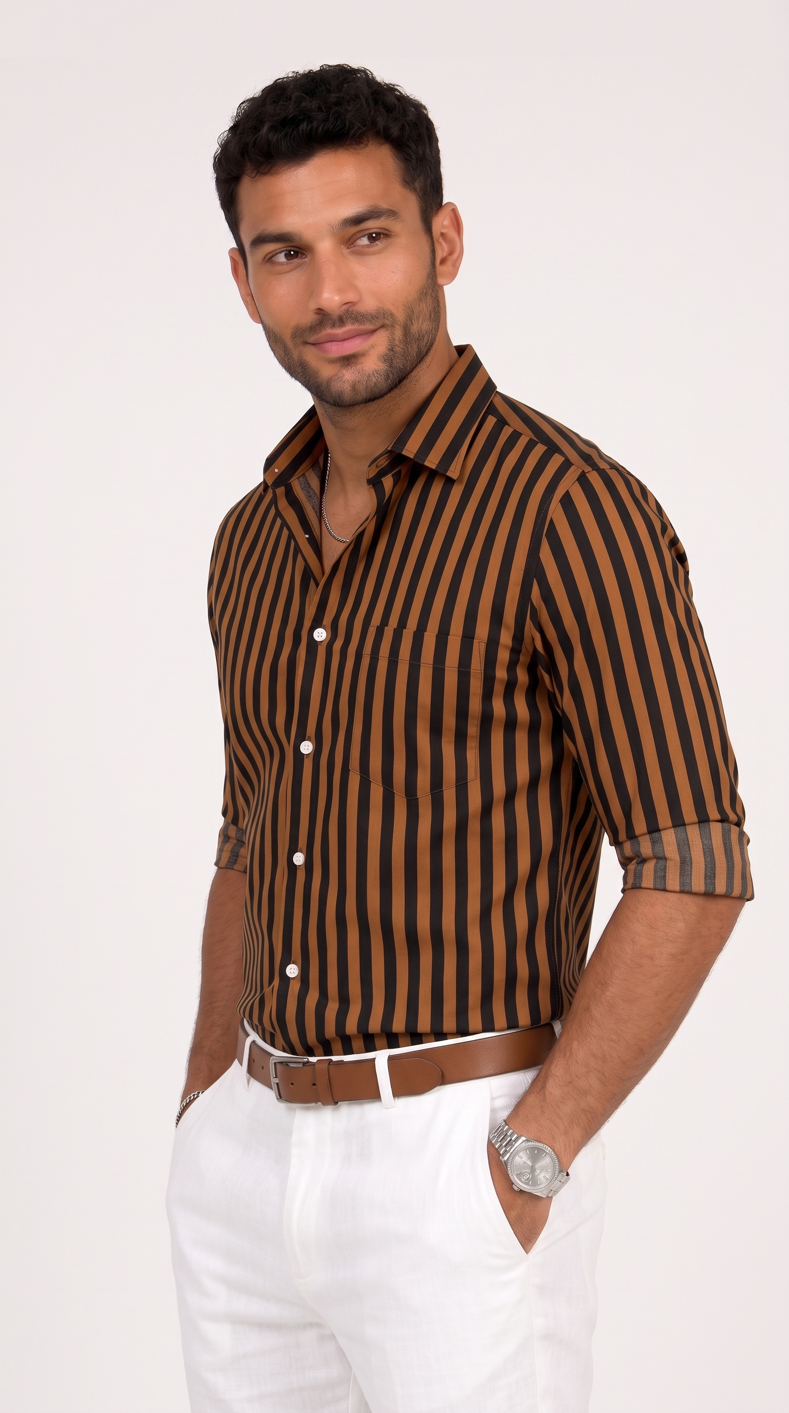 A man wearing a brown and black vertically striped button-down shirt with white trousers, standing against a light gray studio background, from Meleche Fashion USA or Meléche (short as (Mé))