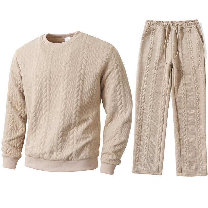 Beige cable knit sweater and pants set on a white background