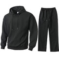 Black hoodie and pants set on a white background