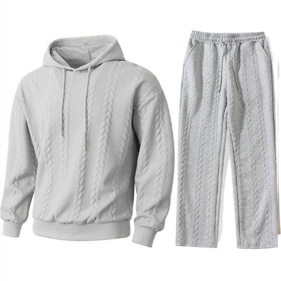 Gray quilted hoodie and pants set on a white background