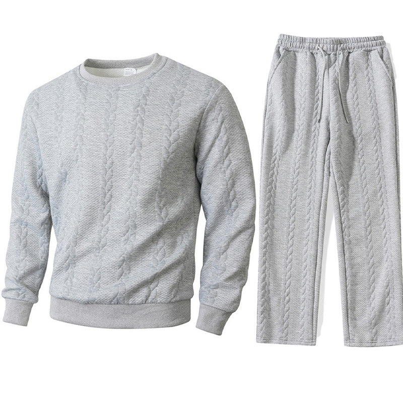 Gray cable knit sweatshirt and pants set on a white background