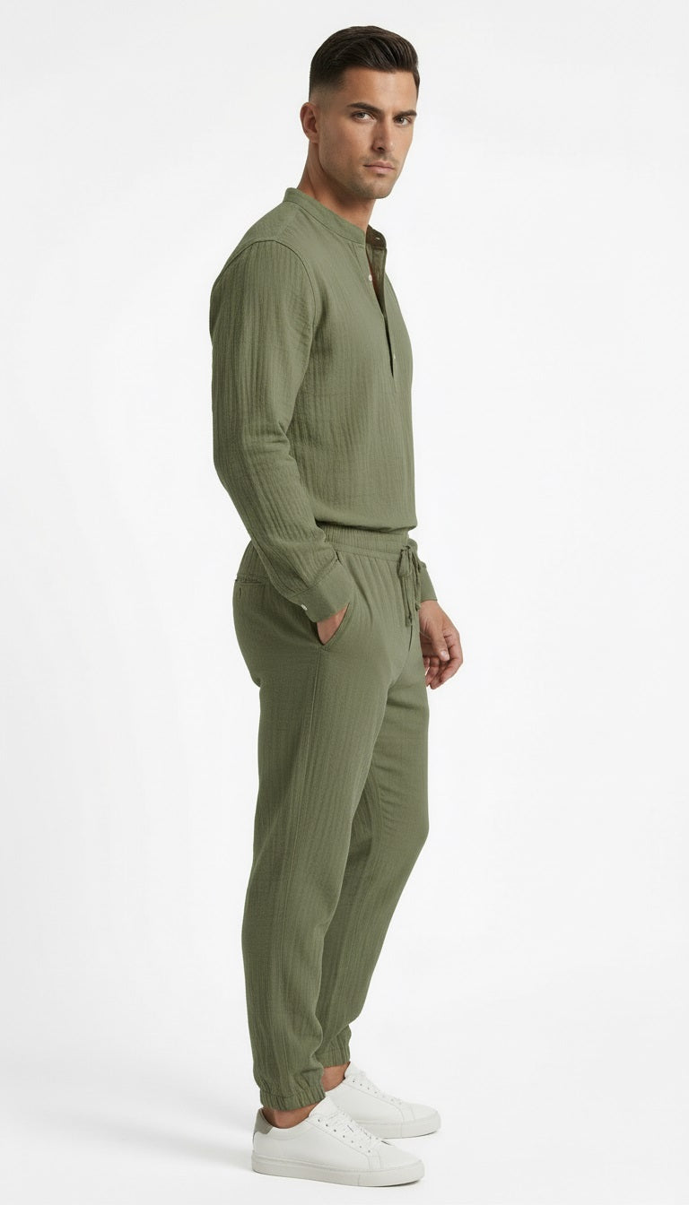 Man wearing a green tracksuit on a white background