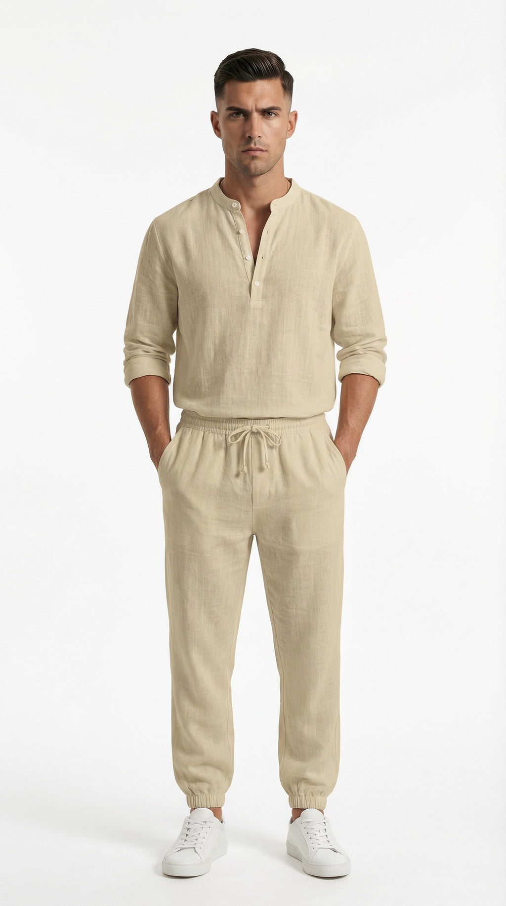 Man in beige outfit standing on a balcony with ocean view and yachts.