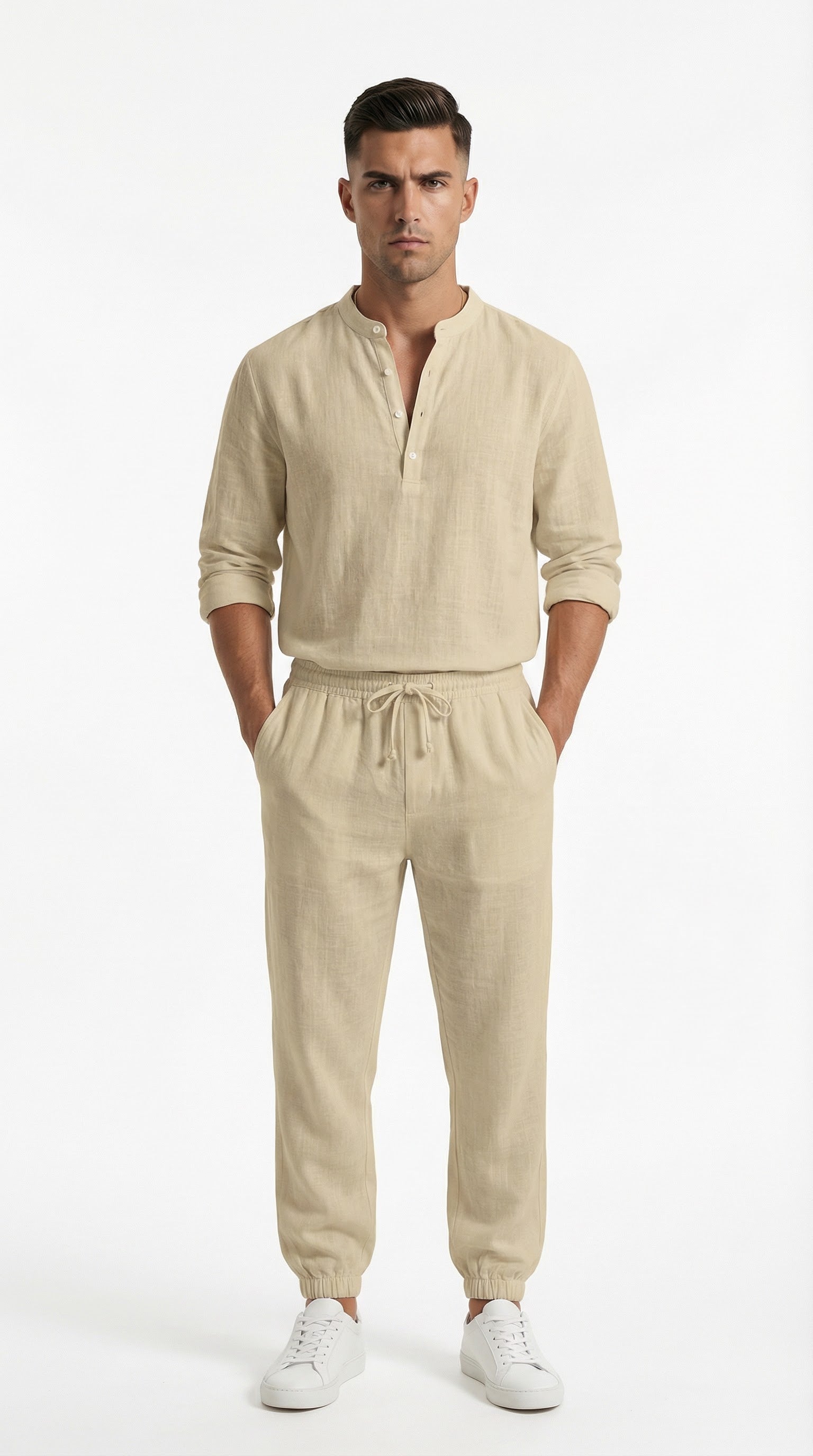 Man in beige outfit standing on a balcony with ocean view and yachts.