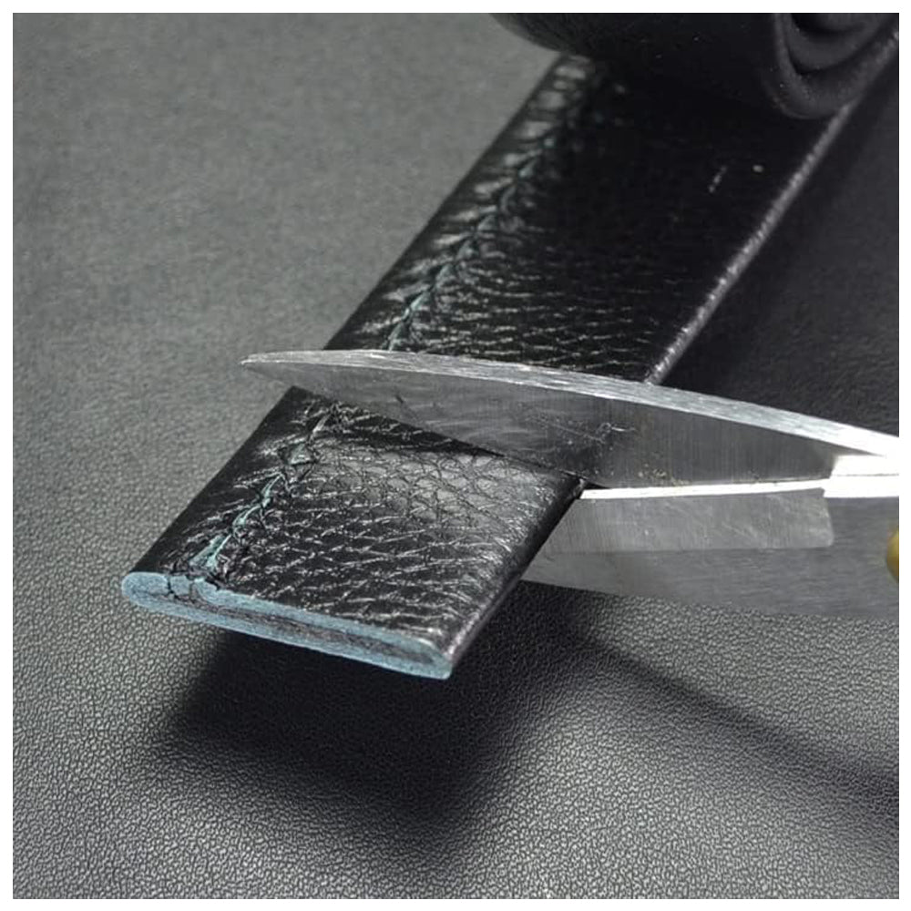 Close-up of a knife cutting through leather from Meleche or Meléche (short as (Mé))