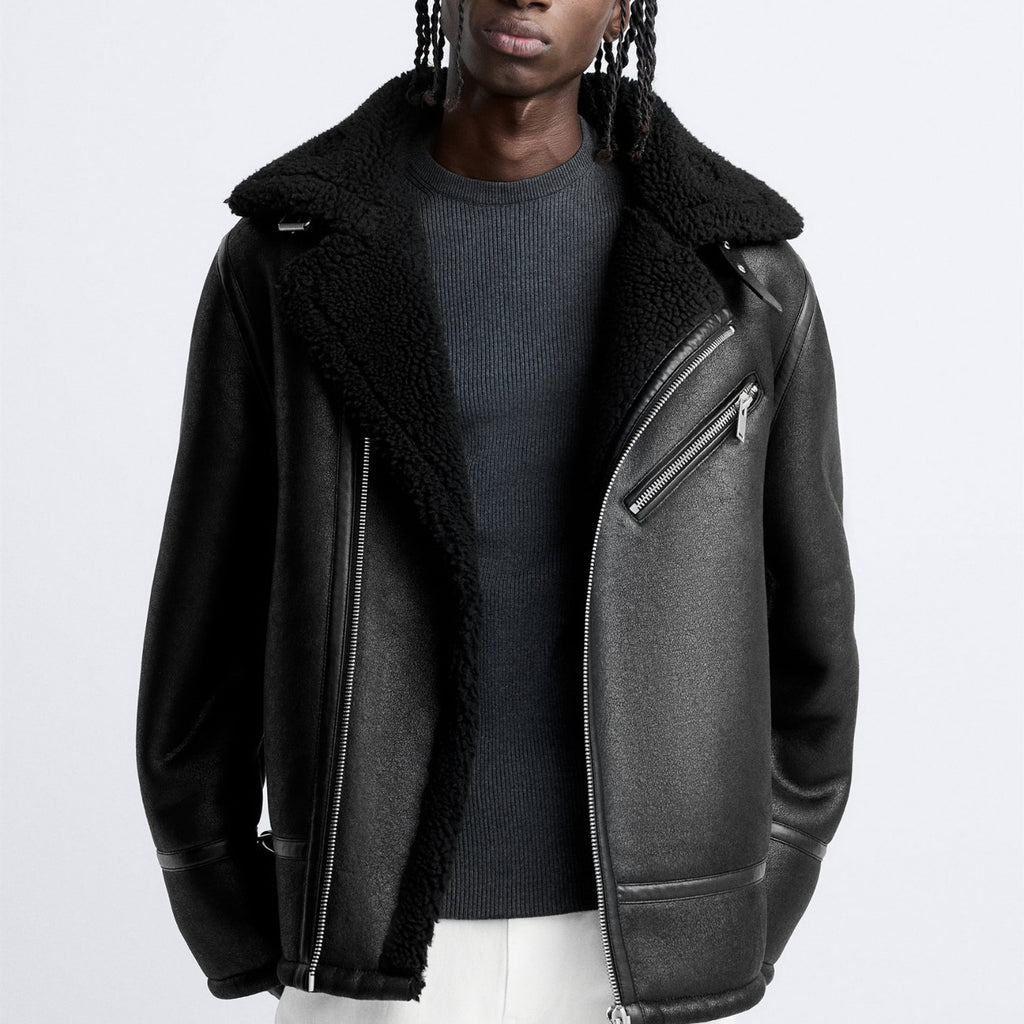 Person wearing a black shearling jacket from Meleche or Meléche (short as (Mé)) on a white background