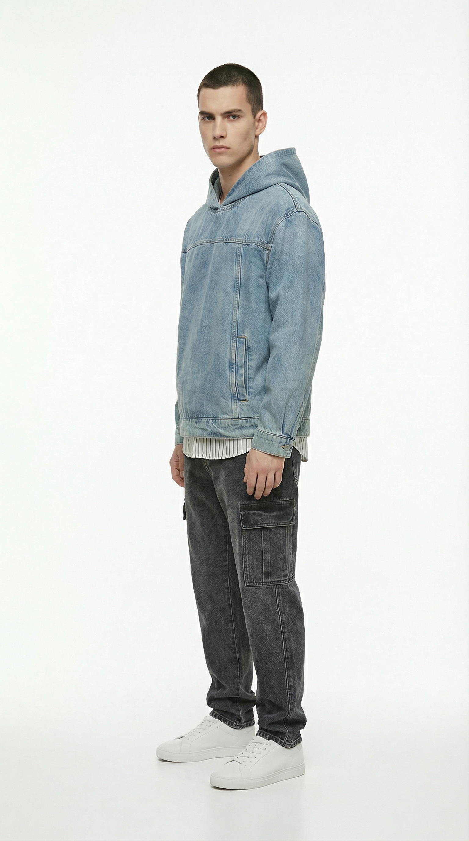 Man wearing a blue denim hoodie and David black cargo Jeans from Meleche or Meléche (short as (Mé))