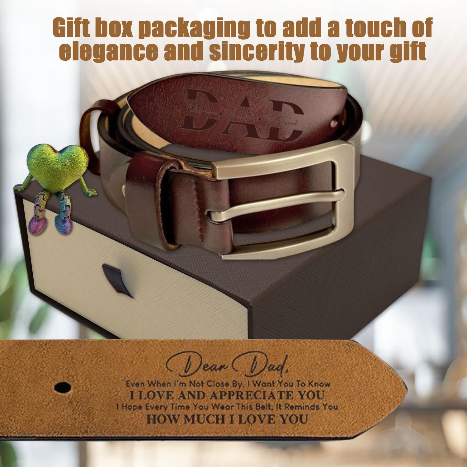 Gael belt Brown leather belt with gold buckle on a gift box, accompanied by a decorative tag from Meleche or Meléche (short as (Mé))