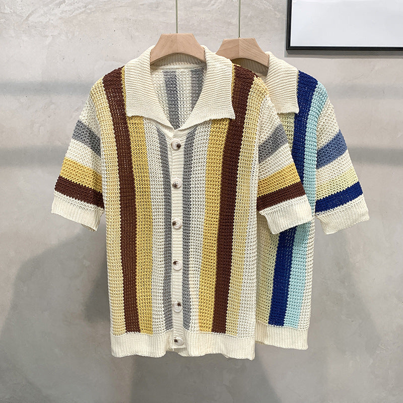 Colorful striped short-sleeve shirt on a wooden hanger against a gray background