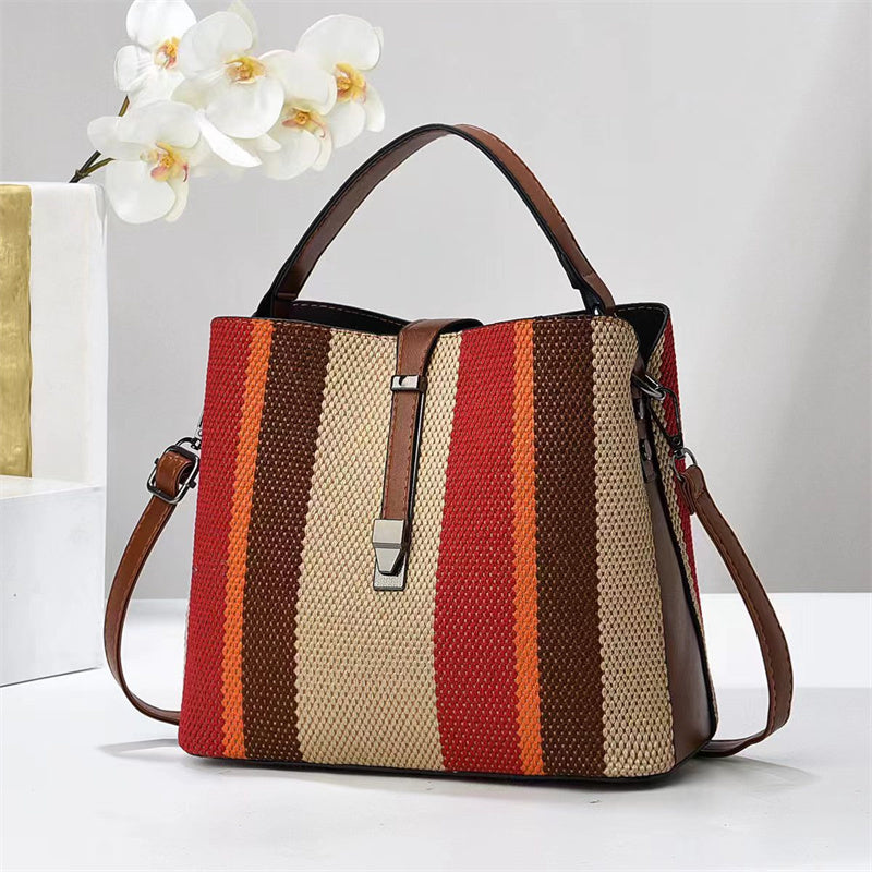 Goran Striped handbag with brown, red, and beige pattern on a white background