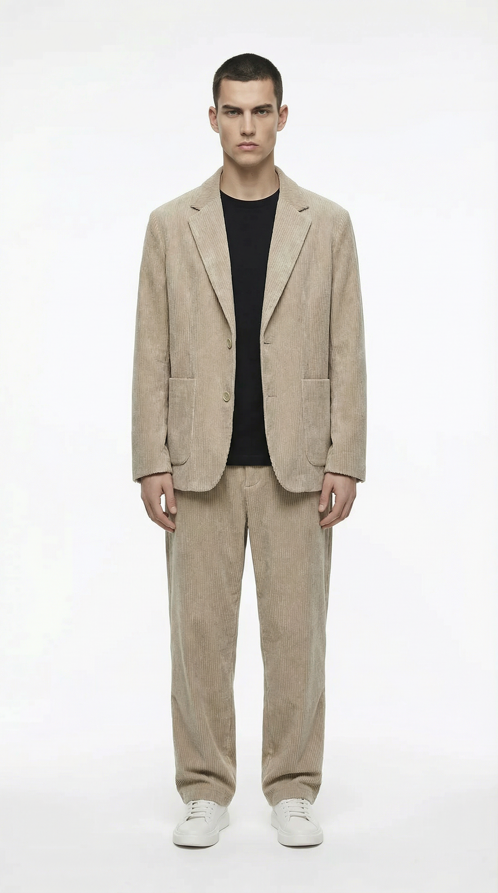 Man wearing a beige suit with a black shirt from Meleche or Meléche (short as (Mé))