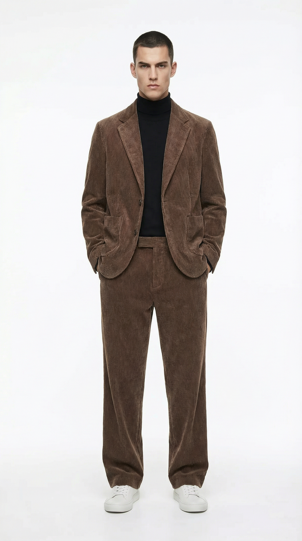 Man wearing a brown suit with a black turtleneck from Meleche or Meléche (short as (Mé))