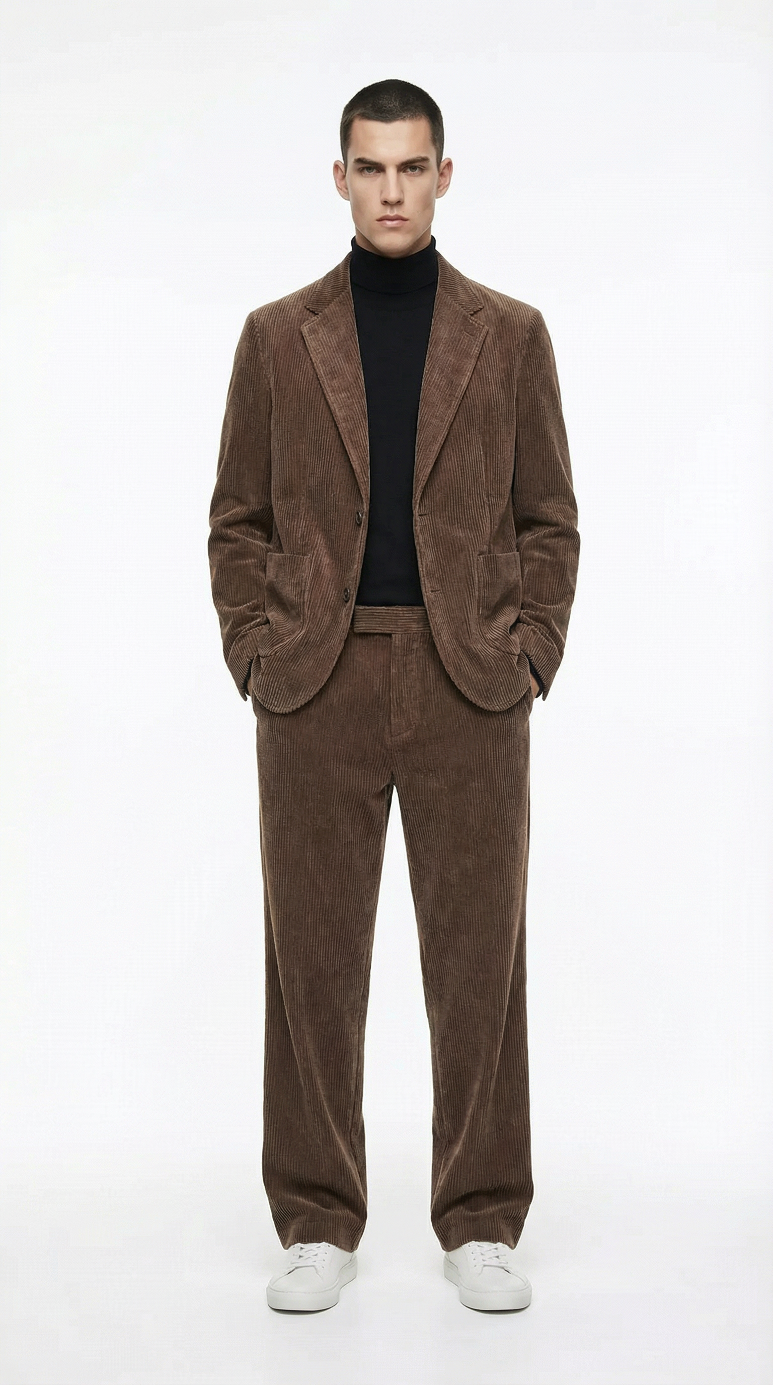 Man wearing a brown suit with a black turtleneck from Meleche or Meléche (short as (Mé))