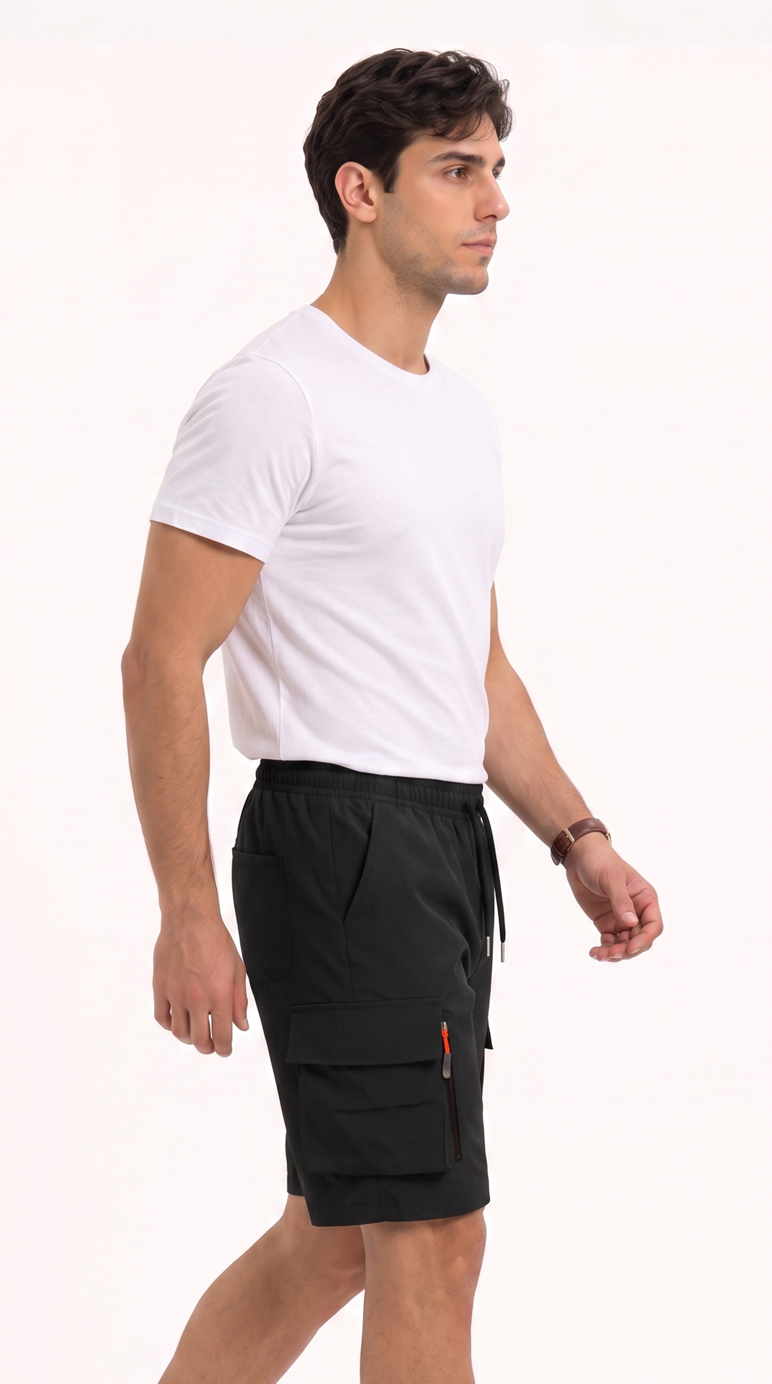 A man wearing a white crew-neck t-shirt and black cargo shorts with a drawstring, shown from the waist down in profile against a plain white studio background, from Meleche Fashion USA or Meléche (short as (Mé))