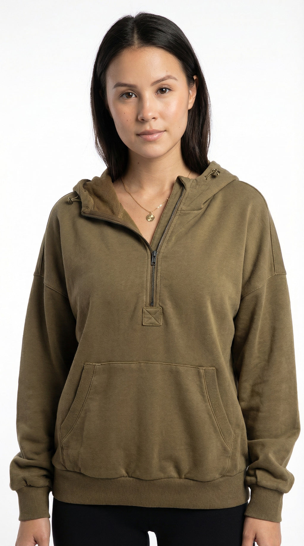 Woman wearing a brown pullover with a hood from Meleche or Meléche (short as (Mé))