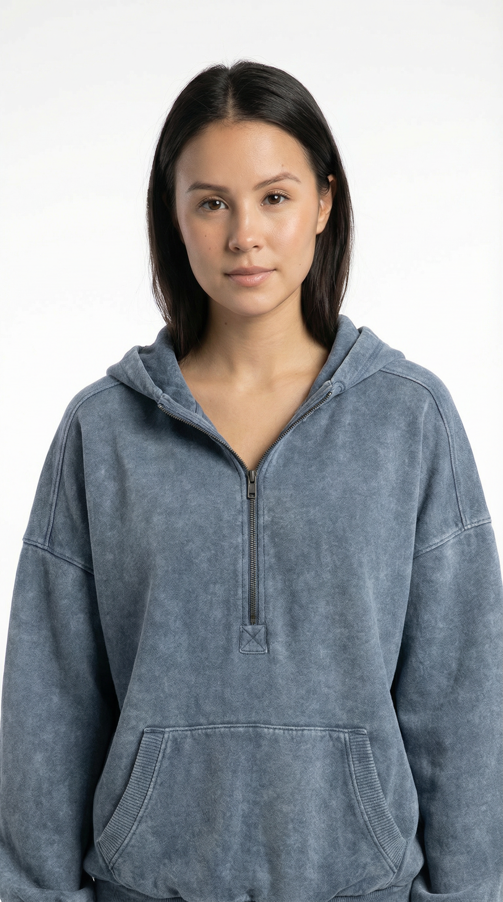 Person wearing a gray hoodie against a white background