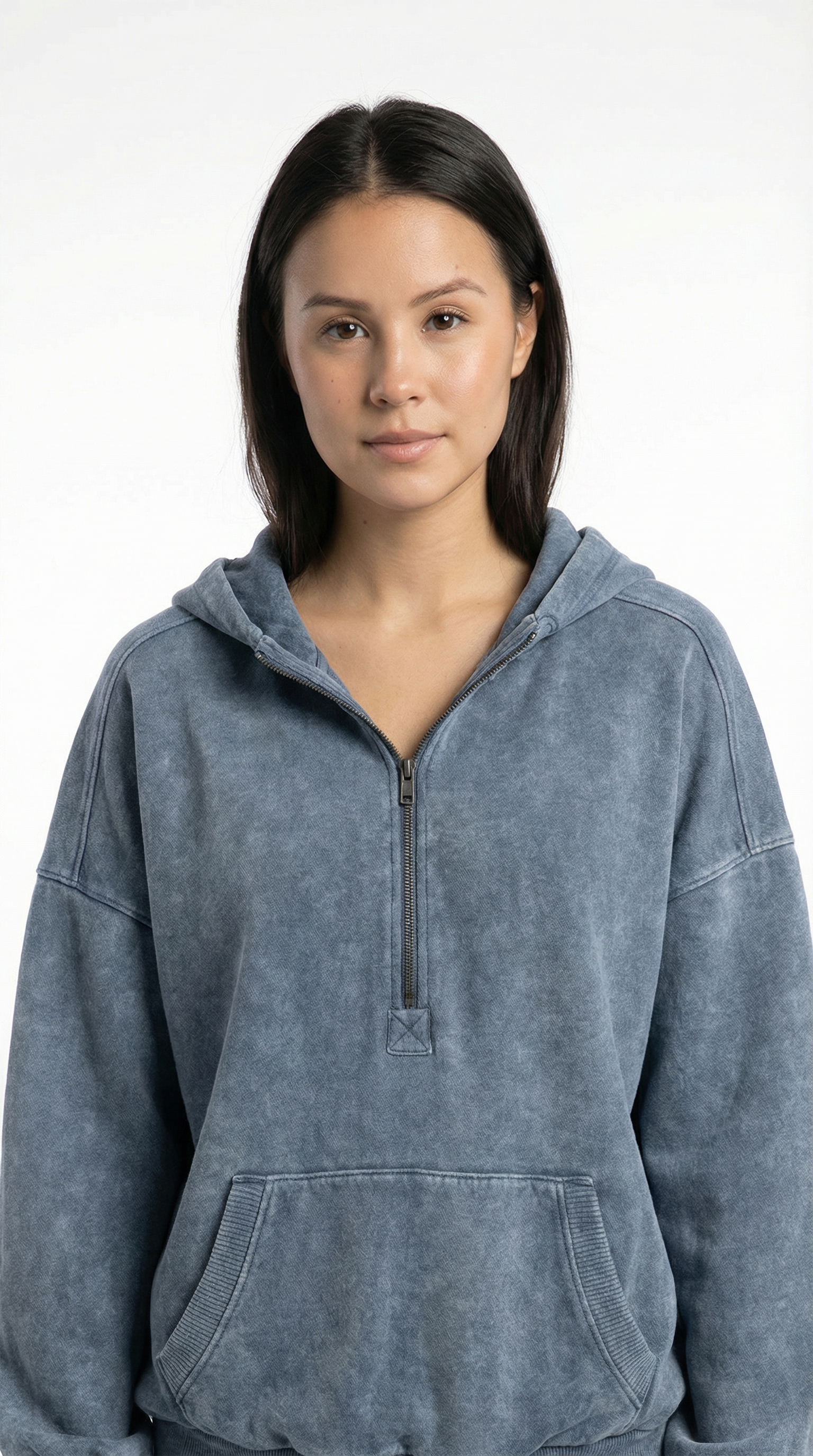 Person wearing a gray hoodie against a white background