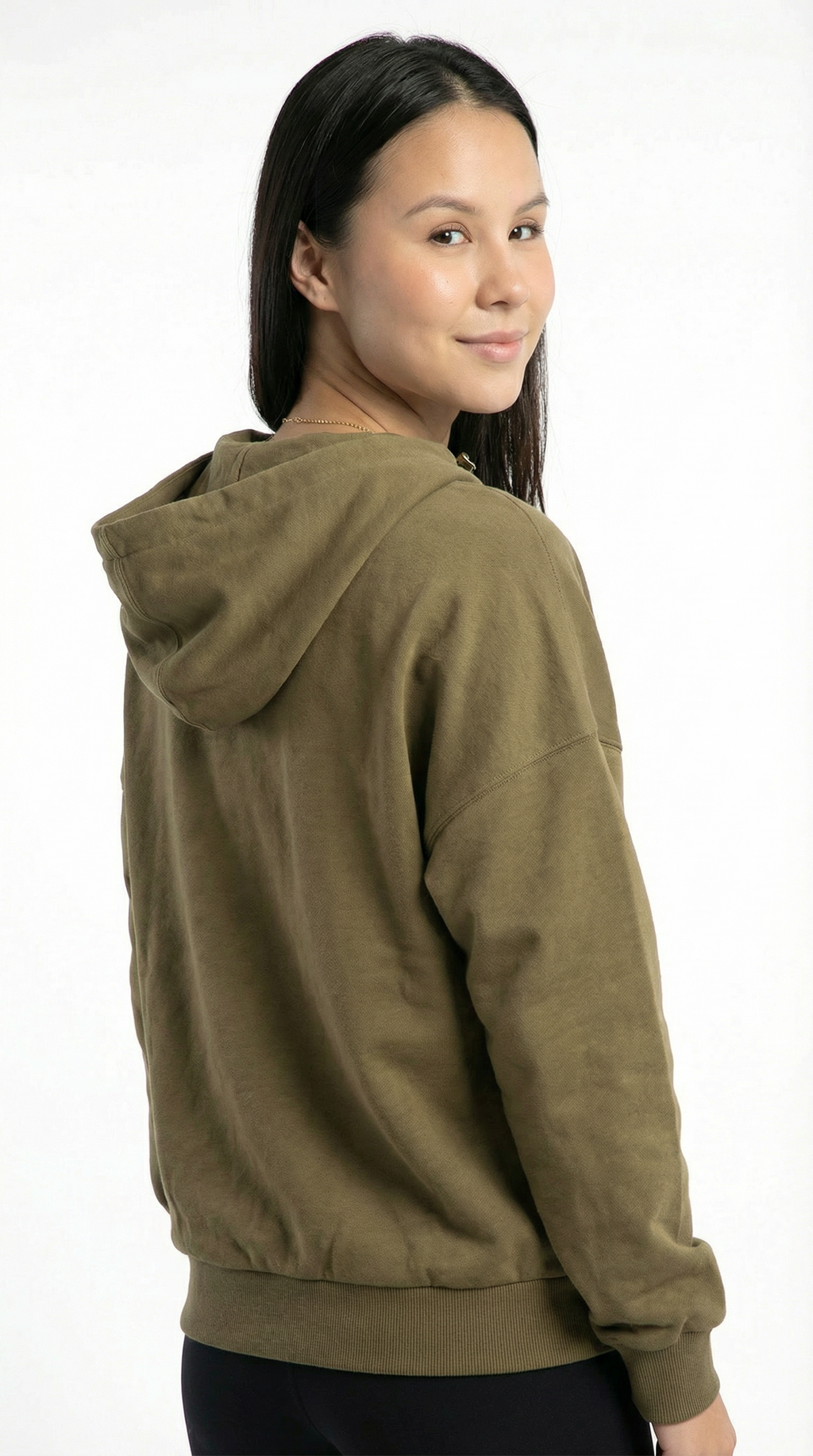 Woman wearing a green hoodie on a white background