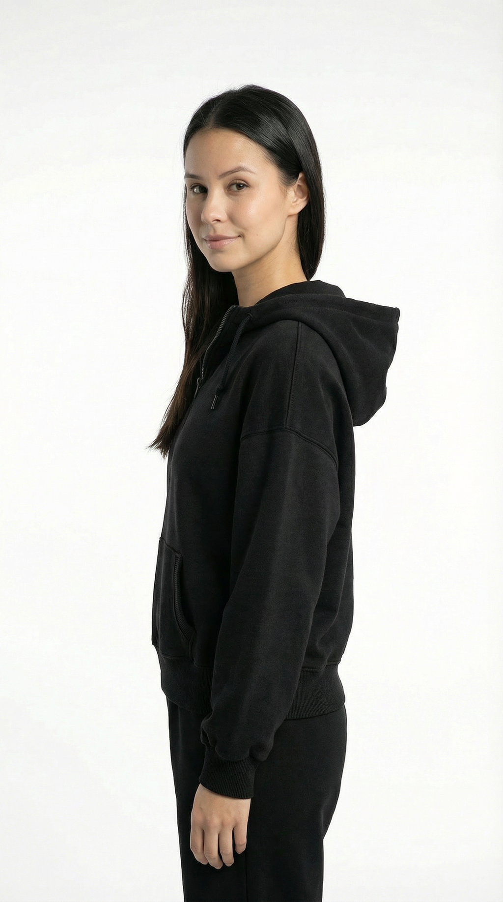 Person wearing a black hoodie on a white background