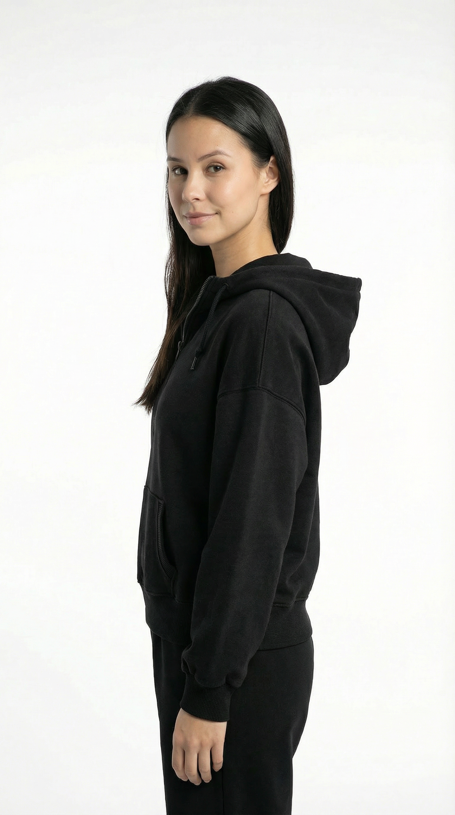 Person wearing a black hoodie on a white background