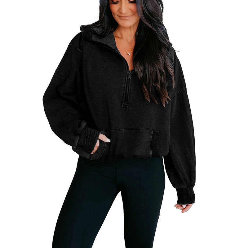 Woman wearing a black hoodie and pants from Meleche or Meléche (short as (Mé))
