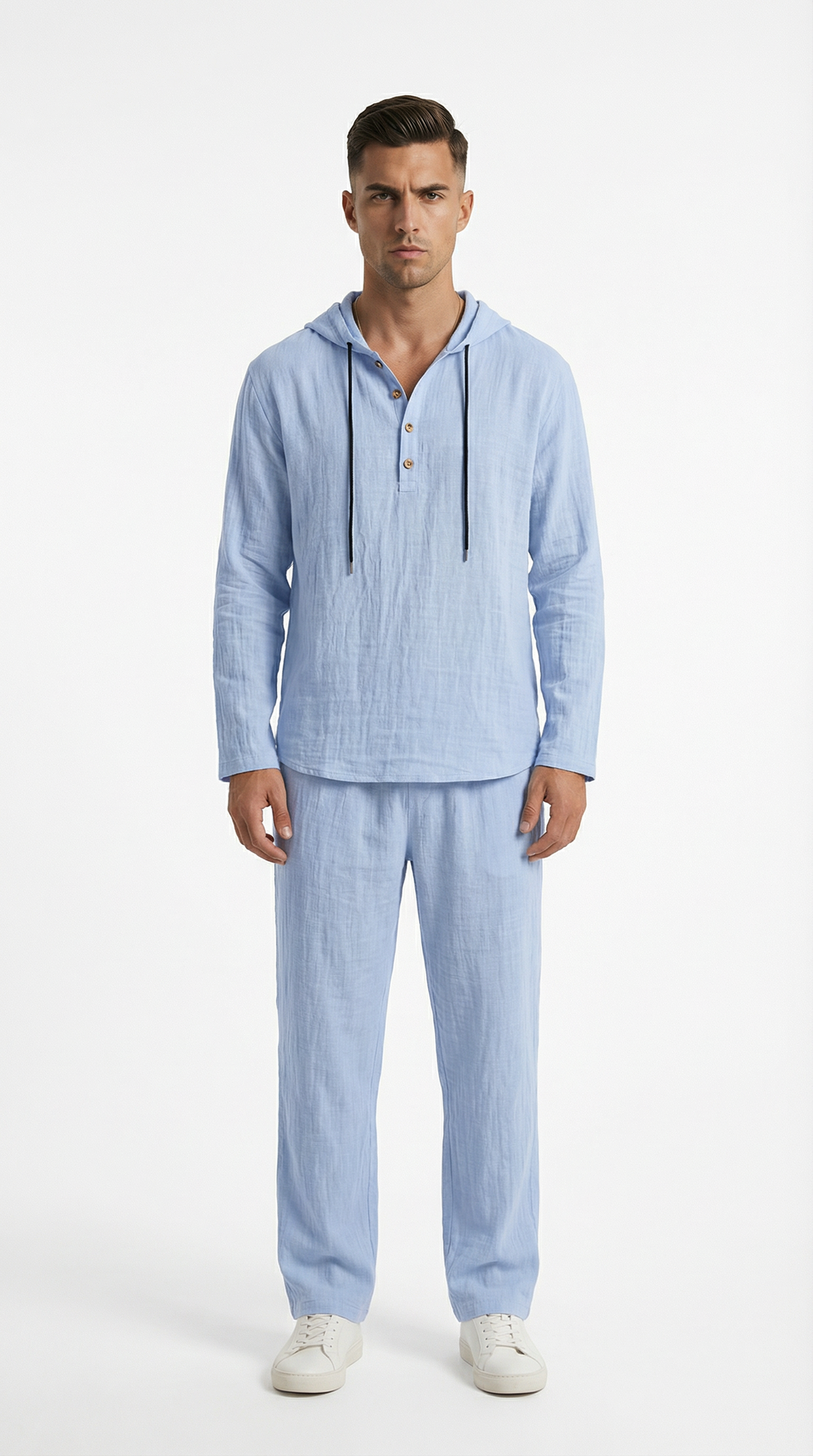 Man wearing a light blue striped pajama set from Meleche or Meléche (short as (Mé))