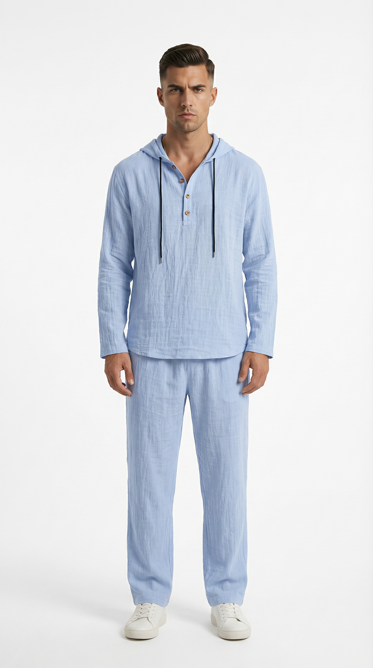 Man wearing a light blue striped pajama set from Meleche or Meléche (short as (Mé))