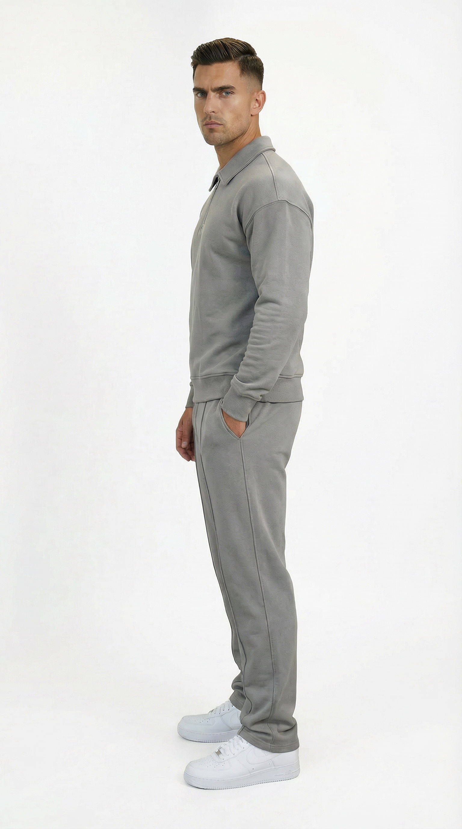 Man wearing a gray tracksuit from Meleche or Meléche (short as (Mé))