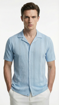 Man wearing a light blue patterned shirt from Meleche or Meléche (short as (Mé))