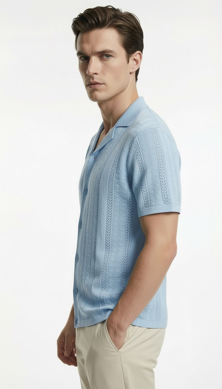 Man wearing a light blue knitted shirt on a white background